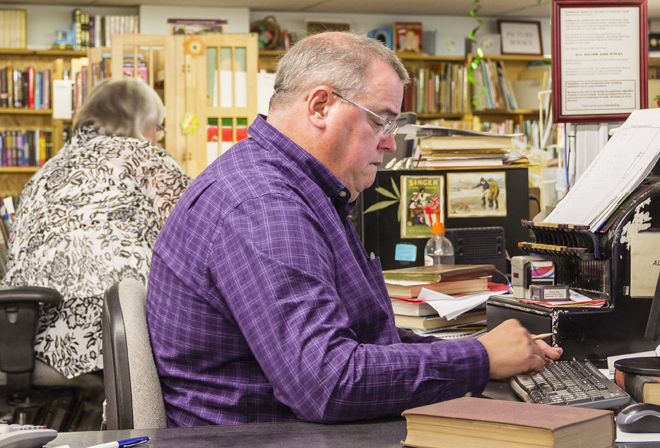 Books End owner Jim Roberts works behind the counter.